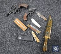 A box containing Eastern knife, assorted penknives,