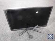 A Hitachi 26 inch LCD TV with remote