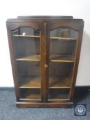 An oak glazed door bookcase