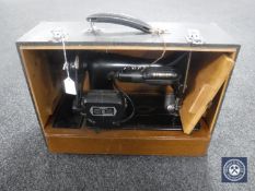 A vintage cased Singer sewing machine