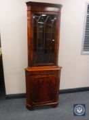 A mahogany corner display cabinet
