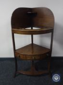 A George III mahogany corner wash stand