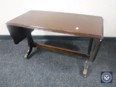 A mahogany sofa/coffee table with under stretcher