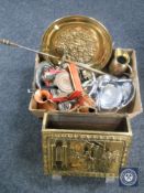 A brass embossed magazine rack, box of metal ware, wall plaques, fire poker,