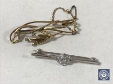 Two gold diamond set brooches, 7.
