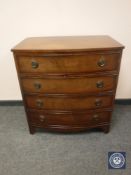 A mahogany bow fronted chest of drawers, width 76 cm.