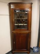 A 19th century mahogany standing corner cabinet,