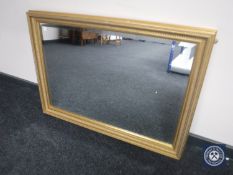 A gilt framed overmantel mirror