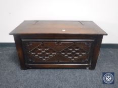 A carved oak blanket box