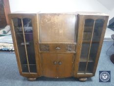 An oak side by side bureau display cabinet