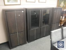 A contemporary black ash triple section sideboard comprising of pair of cabinets (width 70 cm),