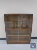 An oak sliding glass door bookcase