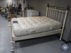 A metal 4'6 bed frame with Silentnight pocket spring interior