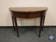 A George III inlaid mahogany D-shaped card table,