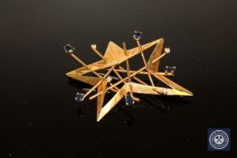 An 18ct gold diamond and sapphire set 'Star' brooch, 11.9g.