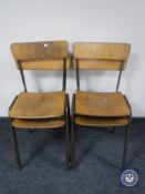 Four mid 20th century metal framed stacking school chairs