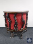 A D-shaped oak driftwood cocktail bar