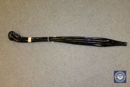 A curious piece of American art modelled as a large melted glass bottle bearing a label 'A