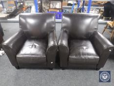 A pair of vinyl armchairs