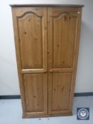 A pine double door wardrobe
