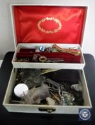 A jewellery containing coins, costume jewellery,