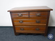 An Edwardian mahogany four drawer chest