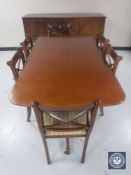 An eight piece late 20th century mahogany dining room suite