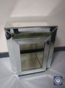 A mirrored occasional table and a mirrored cube stand