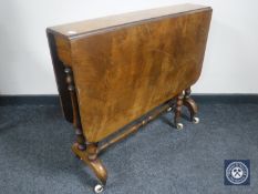 A Victorian walnut drop leaf table