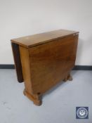 An Art Deco walnut drop leaf table
