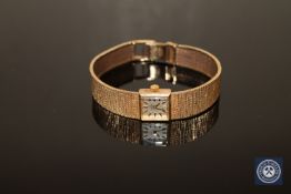 A lady's 9ct gold Omega wrist watch, 27.5g.