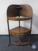 A George III mahogany corner wash stand