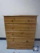 A pine five drawer chest