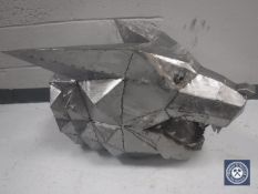 An oak and metal sculpture of a wolf's head