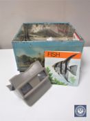 A tin containing view master and quantity of view master slides