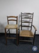 A rush seated ladder back armchair and a stool