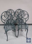 Four cast metal garden chairs