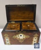 A Victorian walnut domed topped tea caddy with brass and ivory mounts