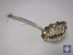 A silver caddy spoon