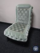 An Edwardian bedroom chair in green button fabric