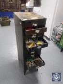 A fifteen drawer metal index chest containing hardware