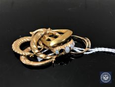 A small collection of 9ct gold to include two rings, two dolphin pendants,