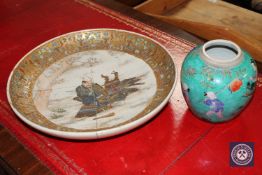 A Japanese Meiji period Satsuma earthenware charger depicting a Samurai warrior (a/f),