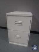 A metal two drawer filing cabinet