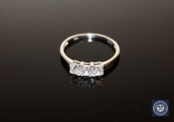 A 9ct white gold CZ three-stone ring, size U CONDITION REPORT: 2.