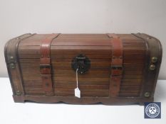 A contemporary storage box with leather straps