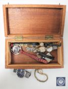 A teak trinket box containing a gent's automatic Seiko wristwatch and other watches