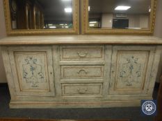 A contemporary painted low sideboard, width 188 cm.