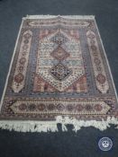 A Persian design rug,