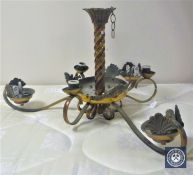 A brass six-way light fitting